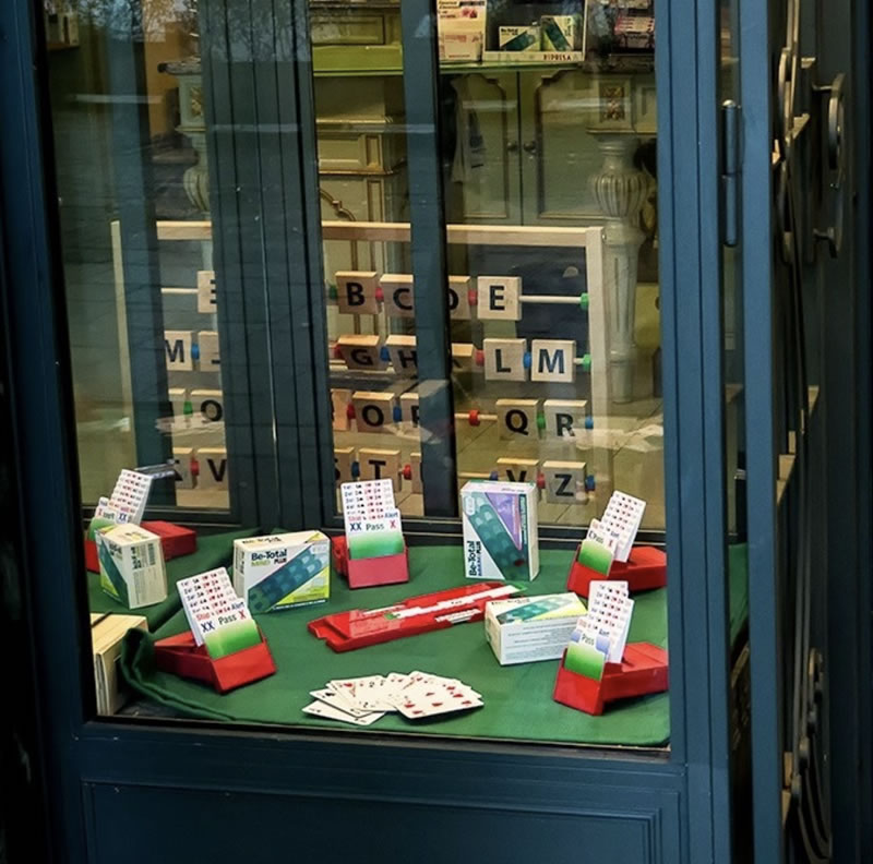 An Italian pharmacy reccomends playing bridge as a form of medicine.